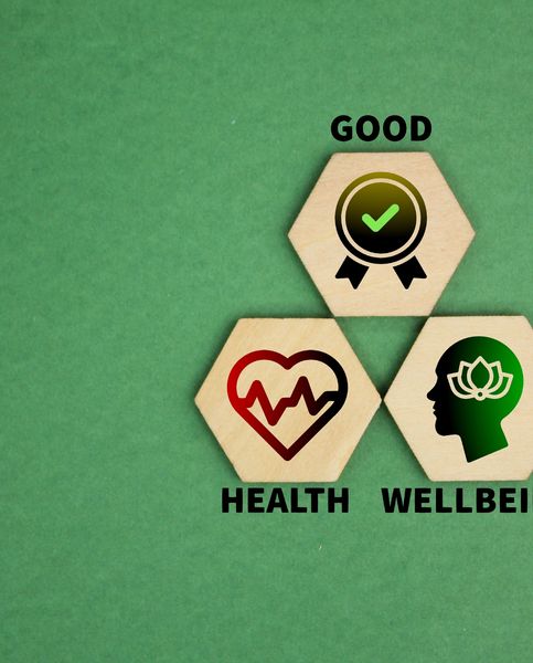 Wooden blocks with icons and words promoting good health and wellbeing.