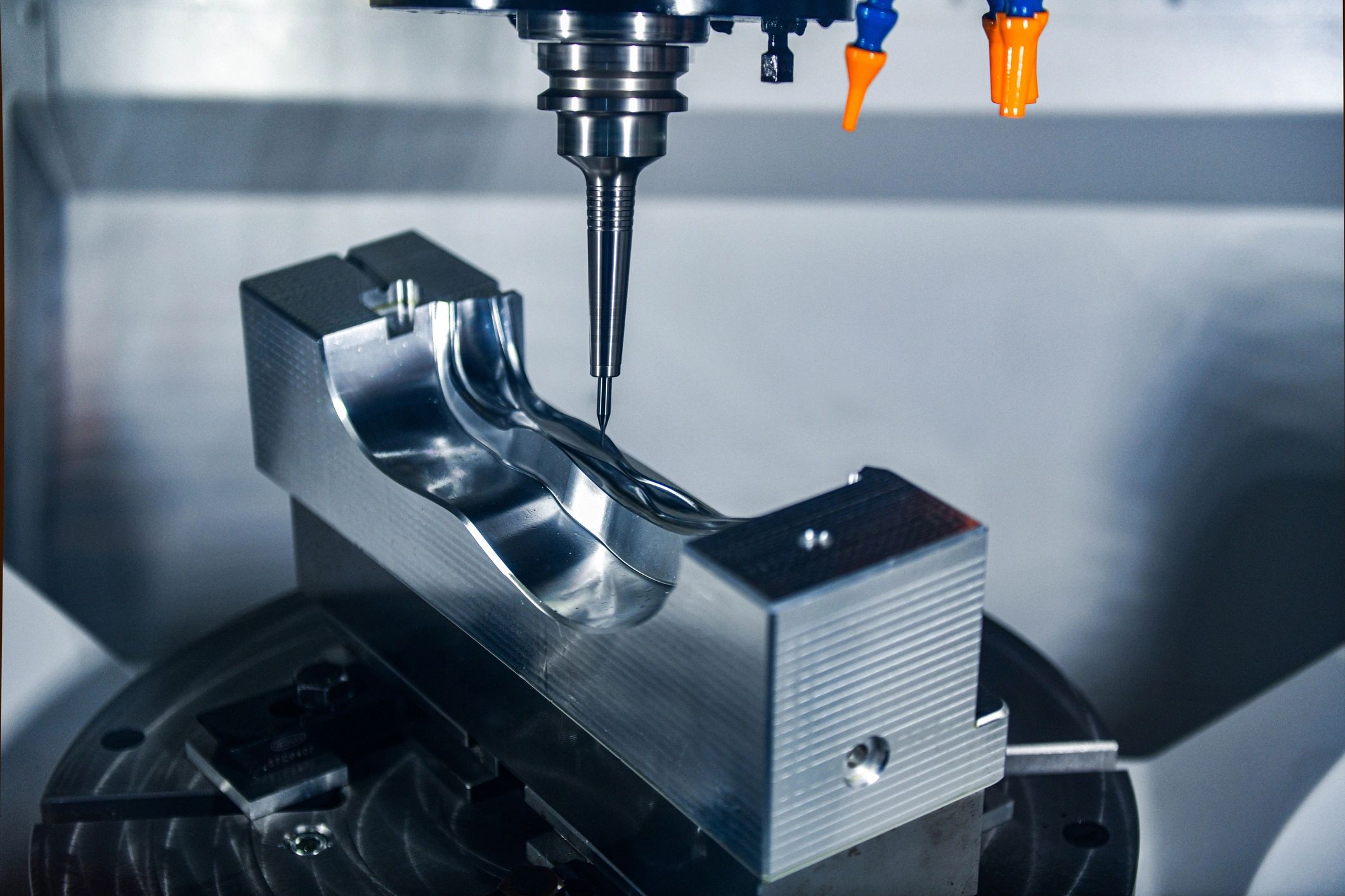 Precision CNC milling of a metal mold.