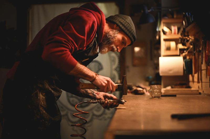 Portrait of Carpenter hammering.