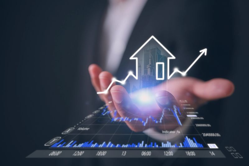 real estate investment concept man hand holding virtual real estate growth graph property value new home for the family, home search, land price, property tax