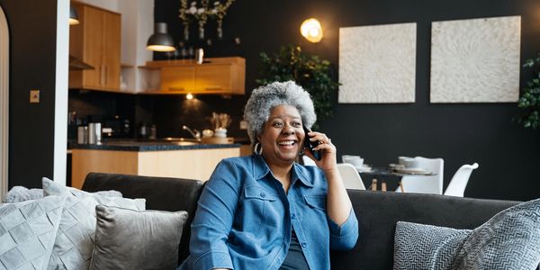 Woman sitting down on the phone