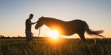 Man and horse sunset experience at Horse & Soul Equine in Hays, Kansas