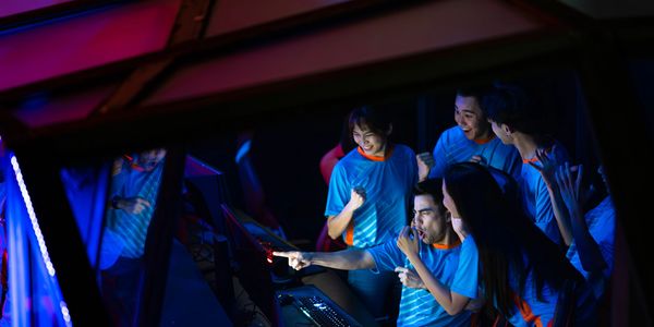Team celebrating a gaming victory together.
