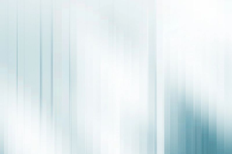 A soft abstract background with vertical light blue and white stripes. The smooth gradient and gentle motion blur create a modern and minimalistic look, ideal for contemporary and futuristic design concepts.