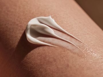 Close-up of moisturizer cream applied on skin.