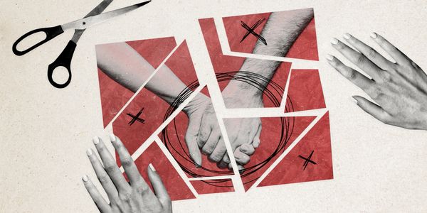 Scissors and fragmented photo of hands holding, symbolizing broken relationships.