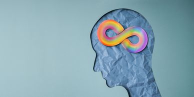 Silhouette of a head with a colorful infinity symbol inside, representing infinite thinking.