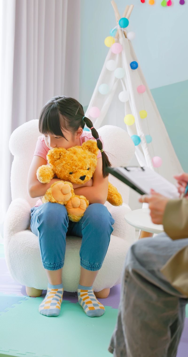 asian children with emotional problems having mental counseling - kid sit with counselor feel unhappy