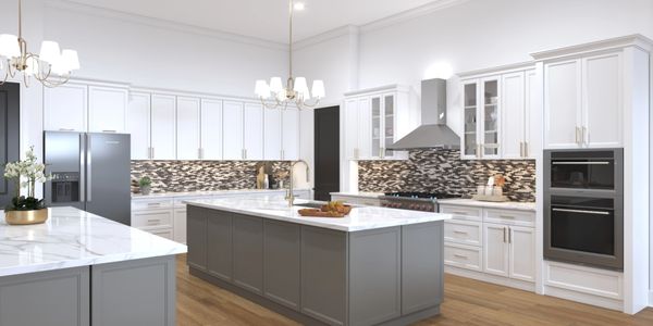 Modern kitchen with gray island, white cabinets, and mosaic backsplash.