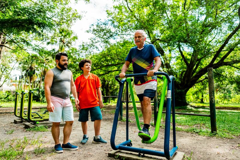 Family exercising at outdoor gym in Ibirapuera Park, Brazil