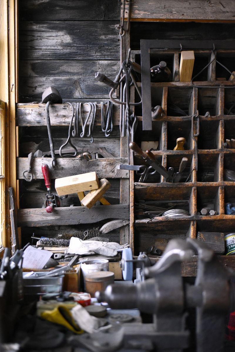 Old tools in a wooden workshop, detail of a workbench and tools