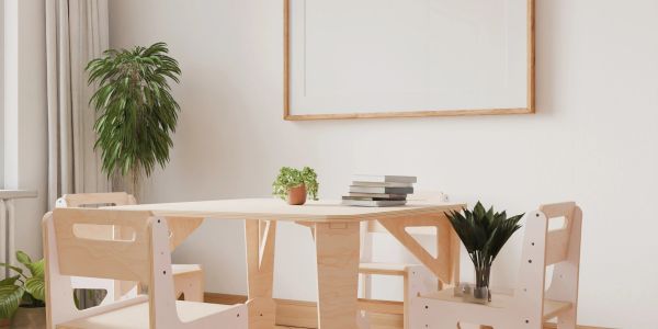 Minimalist dining area with wooden table and chairs.