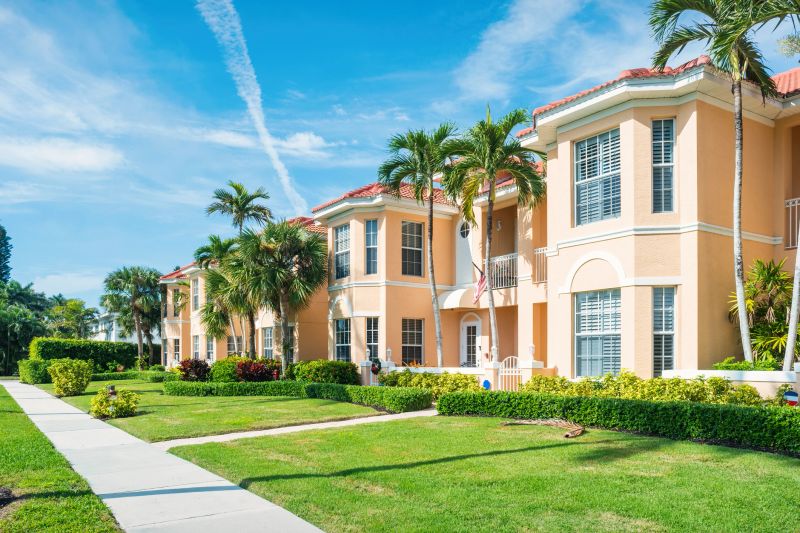 Townhouses and palm trees in Naples, Florida, USA on a sunny day