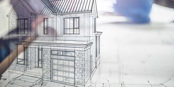 Architectural plans and a house sketch on paper.