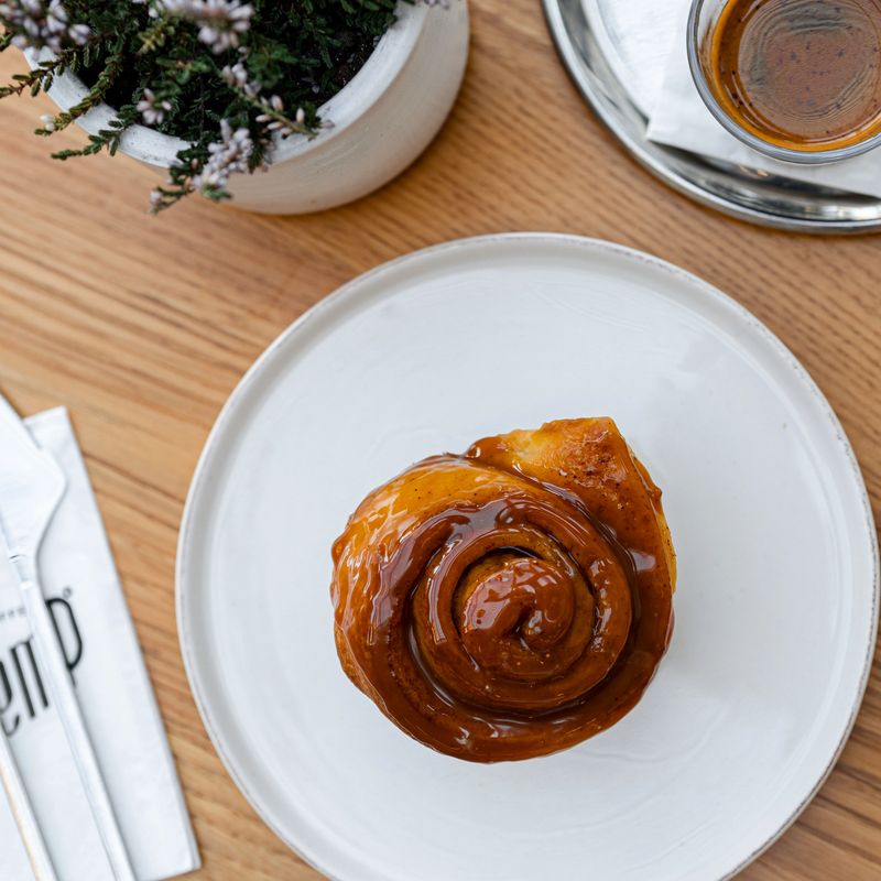 A gourmet sweet treat presented elegantly in a charming café setting.