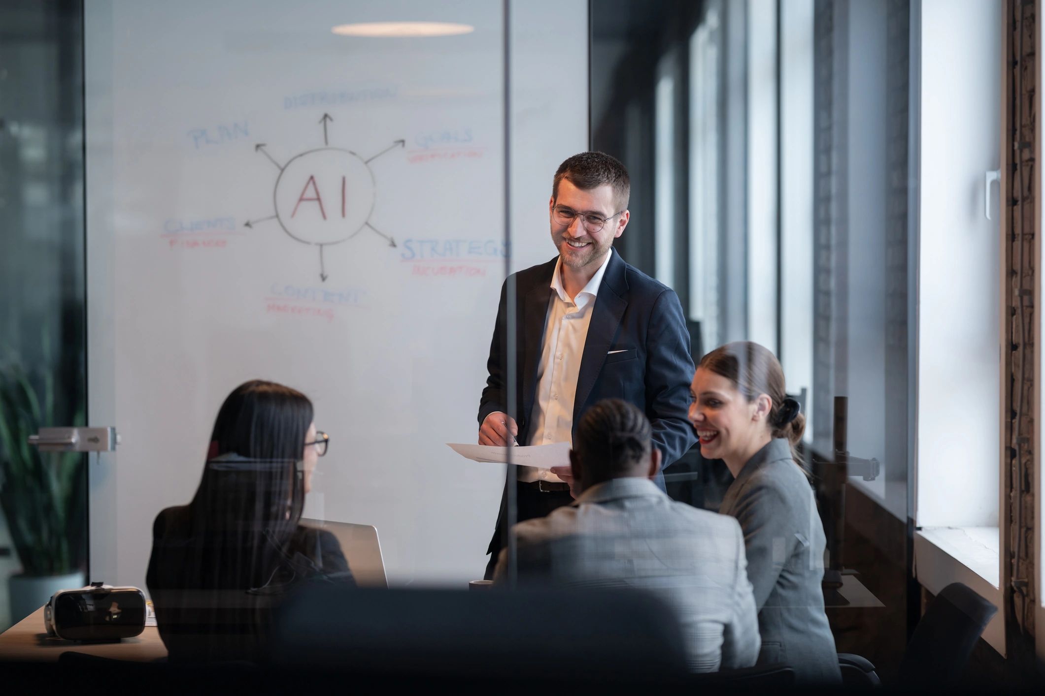 Business team discussing AI strategy in a modern office meeting.