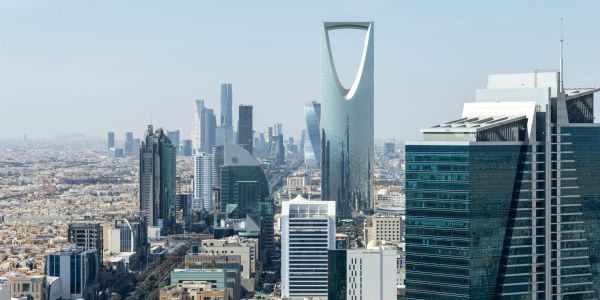 Skyline of Riyadh with the iconic Kingdom Centre Tower in view.