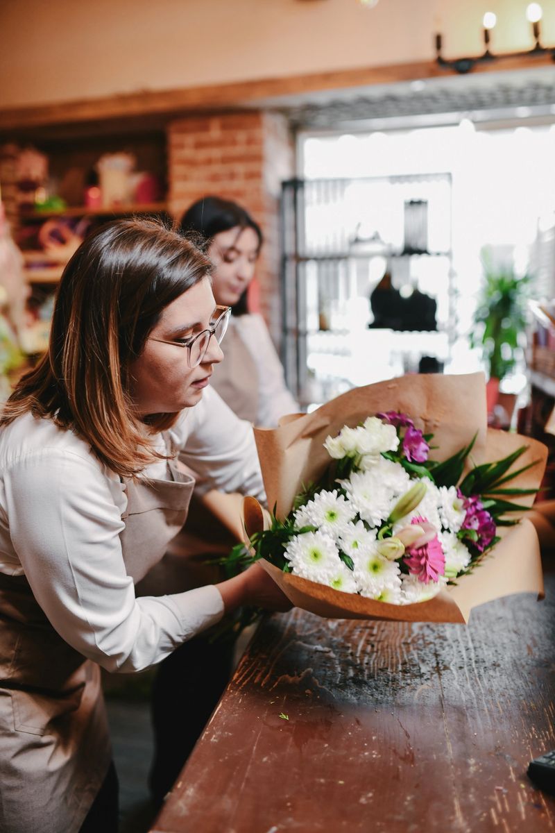 Creative Florist Making Beautiful Bouquet With Colorful Fresh Flowers