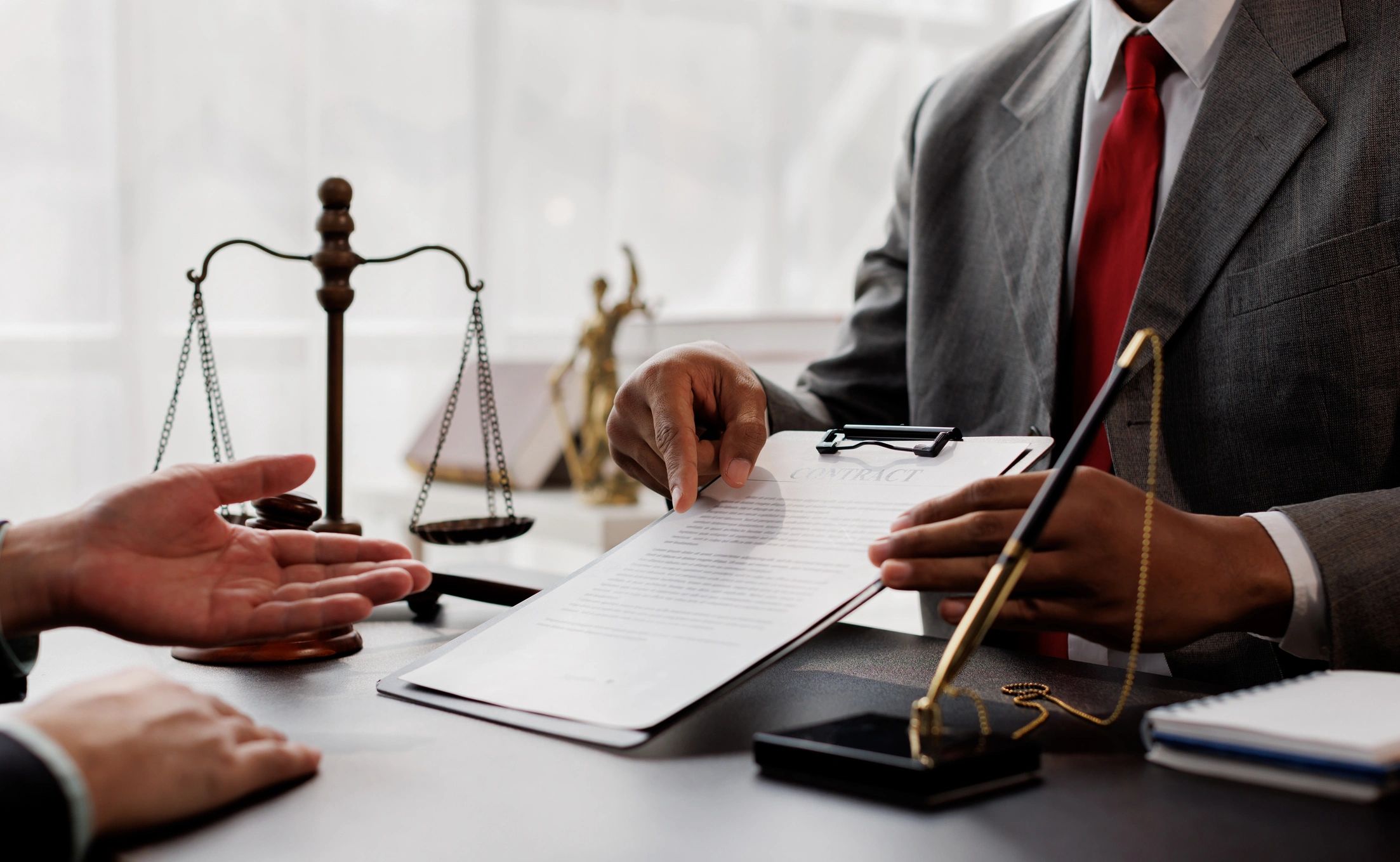 Lawyer explaining contract to client.