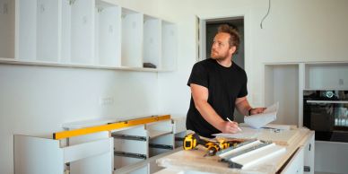 Man working on kitchen assembly plans in Marysville