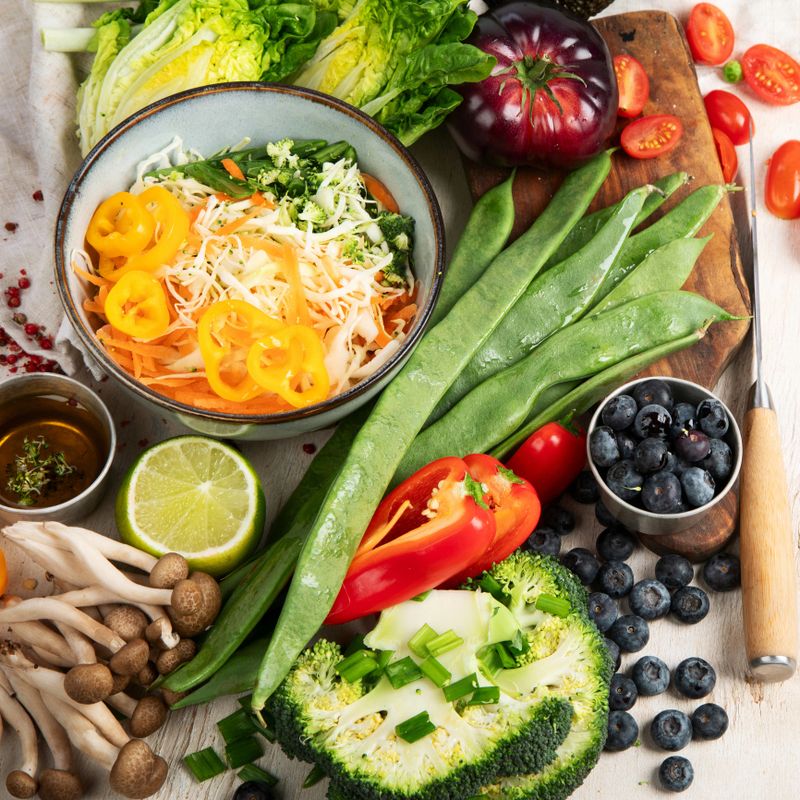 Ingredients for vegetable salad. Delicious healthy food. Vegan concept. On a light background, top view.
