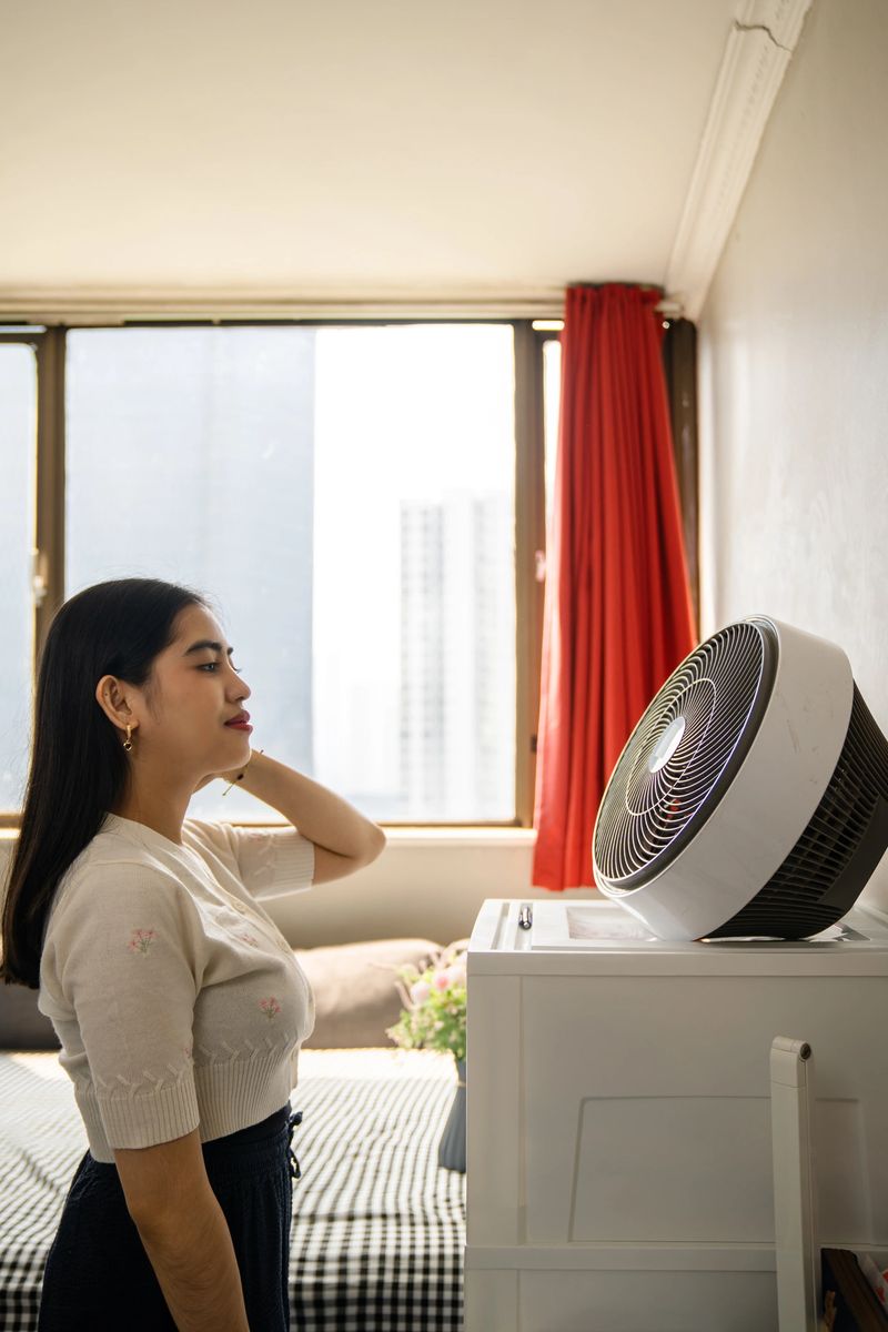 Young woman at dorm room. Getting ready for going out on classes.