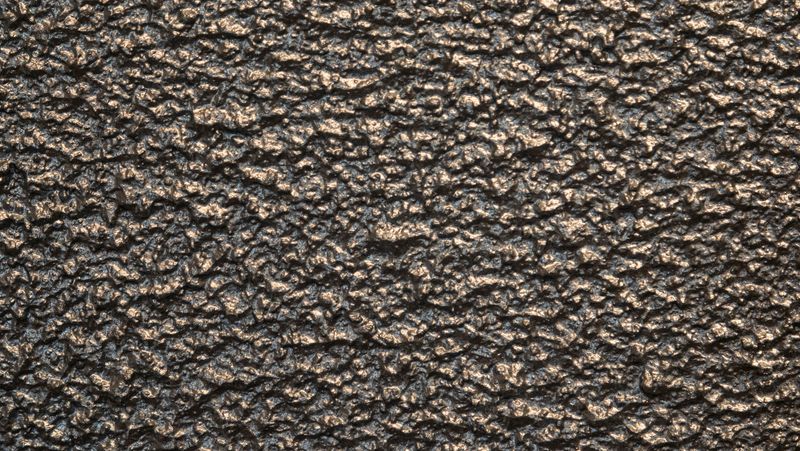 Detail of dark coloured paint texture