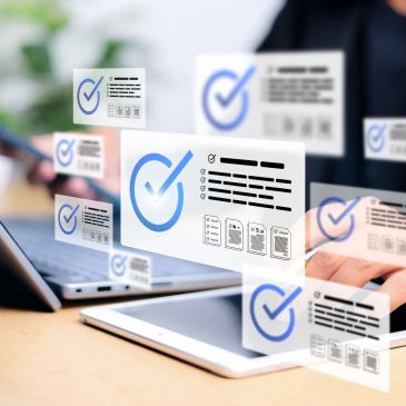 Futuristic digital checklists overlay on laptop and tablet use.