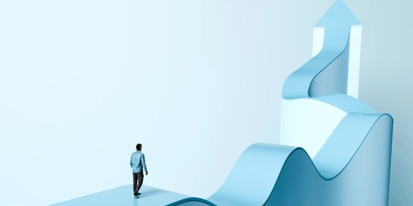A man walks towards a blue upward arrow path symbolizing growth and progress.