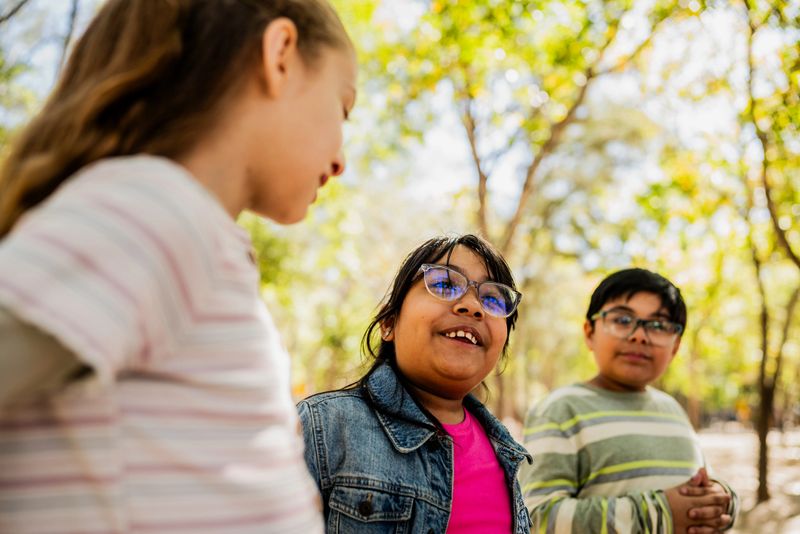 Child friends talking on public park