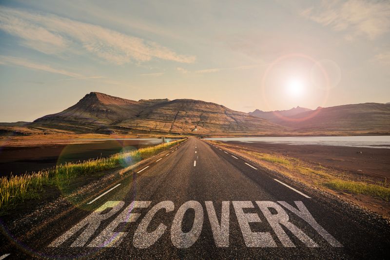 A beautifully scenic road symbolizes hope and recovery, vividly capturing a serene landscape and a bright future ahead