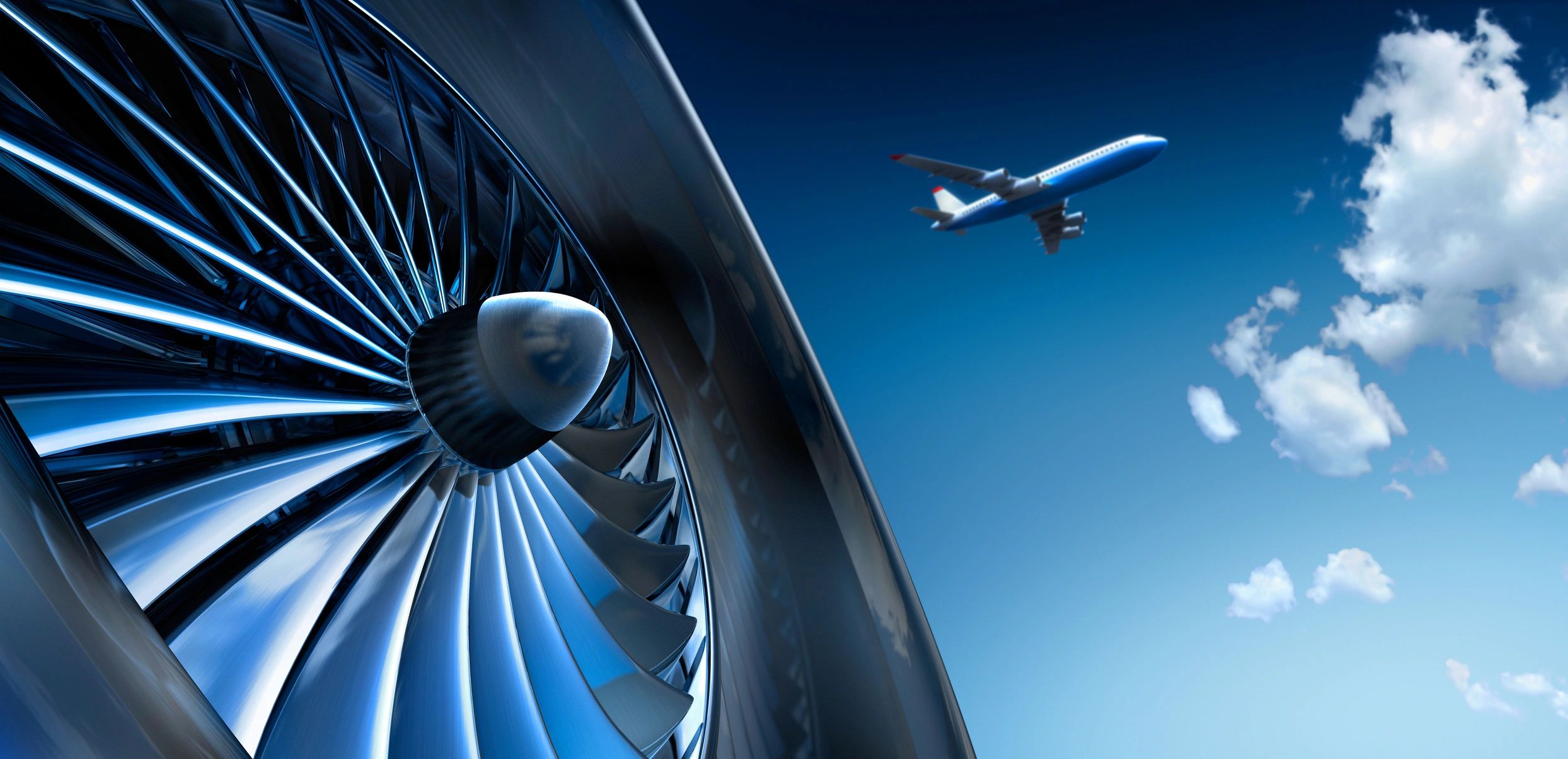 Close-up of a jet engine with a plane flying in the sky.