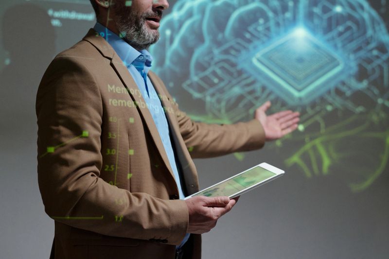 Cropped shot of unrecognizable expert giving presentation on neural interface technology and holding tablet while speaking on stage copy space