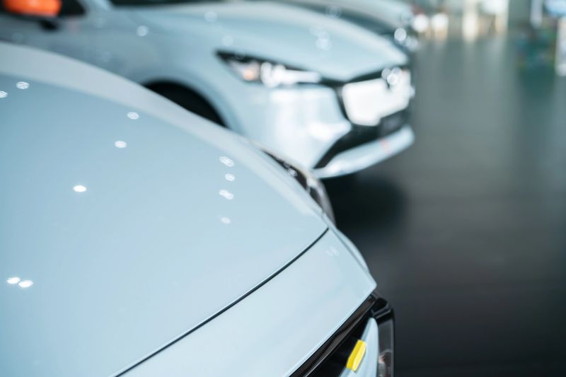 Showroom displaying a lineup of imported cars available for purchase at Atlas Storage.