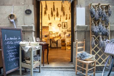 Charming store entrance with dried lavender and handwritten chalkboard sign.