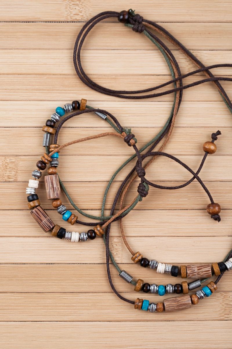 Handmade jewelry on wooden background