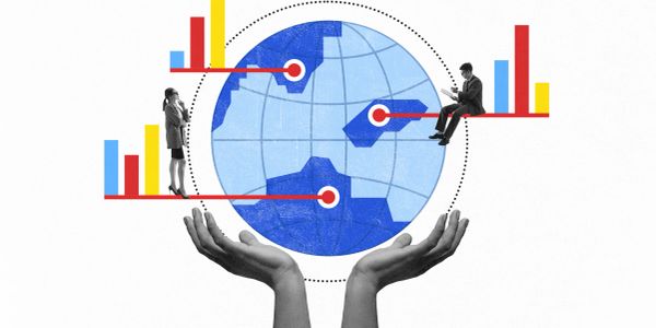 Hands holding a globe with businesspeople and data charts.