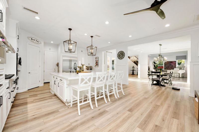 A bright and elegant open-concept living space with a modern furnishing in a luxury home