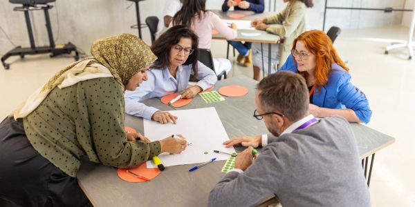 Group of diverse people collaborating at a table.
