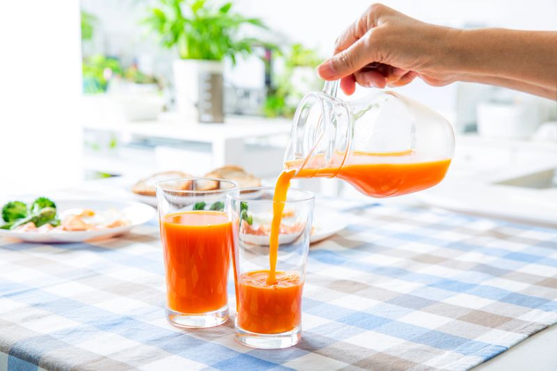 Pour vegetable juice. Healthy cooking, refreshing breakfast table,