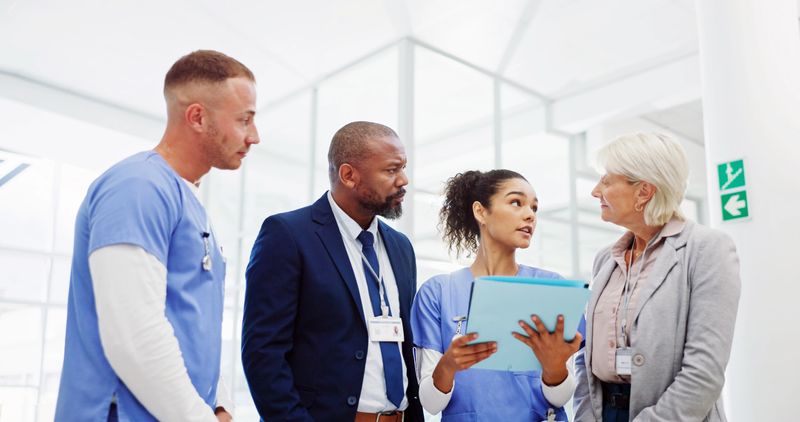 Collaboration, medical and meeting with hospital manager speaking to staff for healthcare planning. Administration, conversation and management with professional speaking to medicare team in clinic