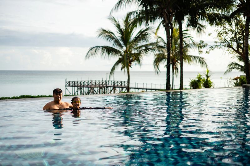 mature couple in  swimming pool. Leisure and pleasure concept