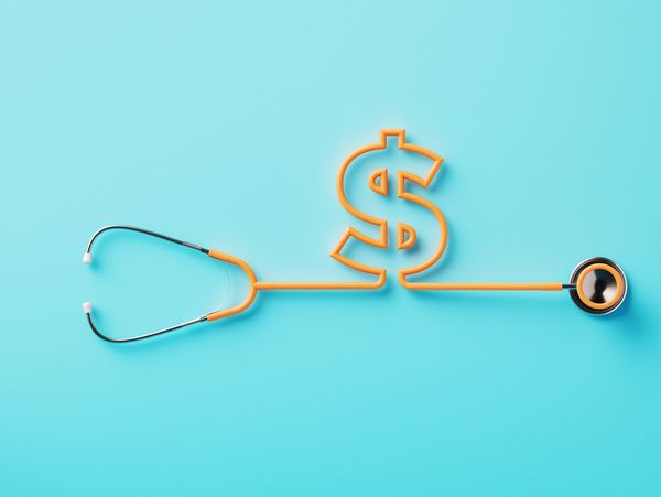 Stethoscope shaped into a dollar sign on blue background.