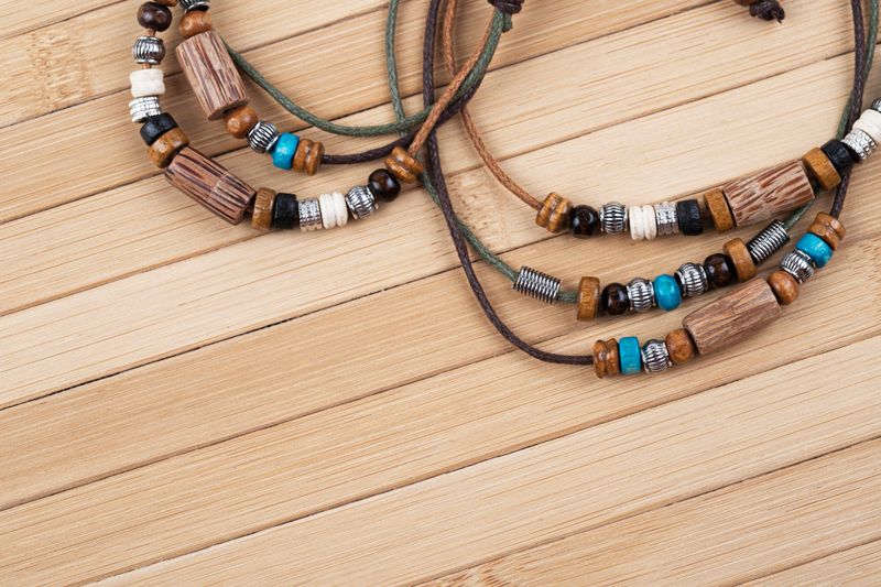 Handmade jewelry on wooden background