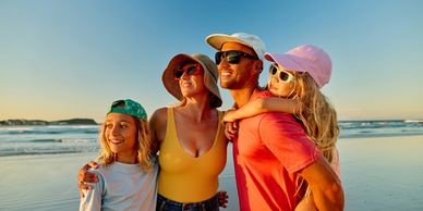 Family enjoying a sunny beach day together.