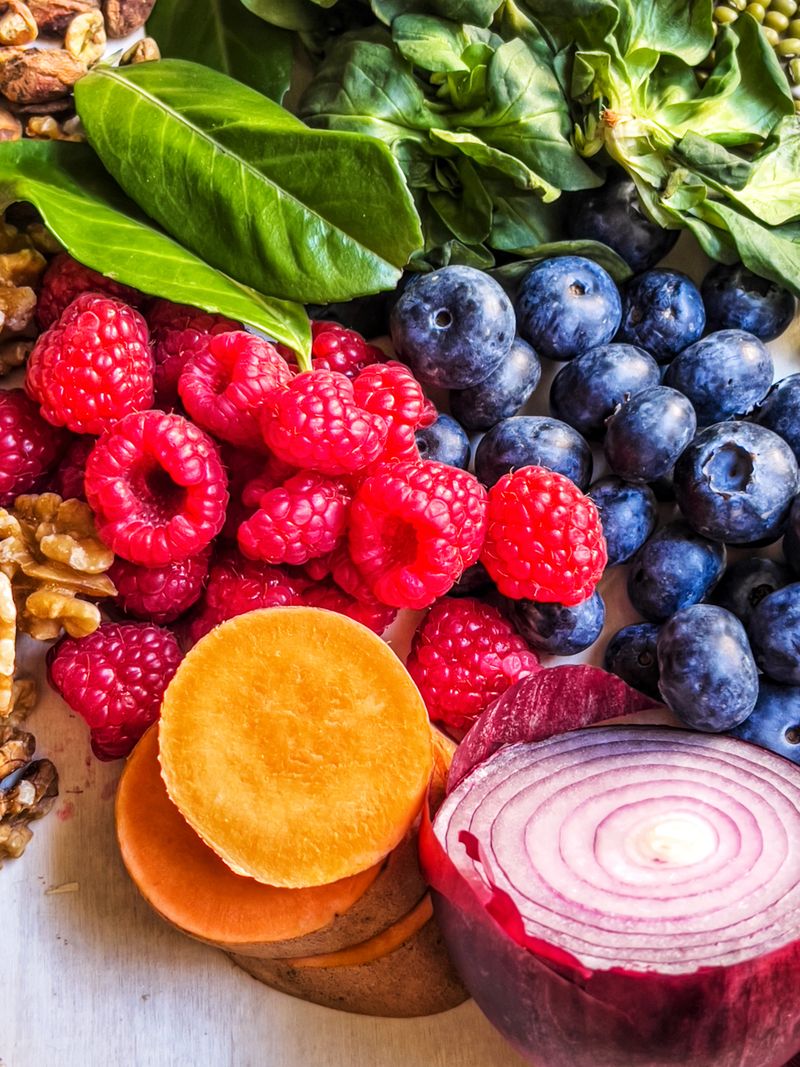 Anti-inflammatory vegetables, fruits, legumes and nuts relieving health problems - vegetables, fruits and nuts for health benefits on wooden table - healthy eating, superfood