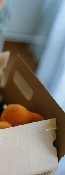 Cardboard box with peaches inside.