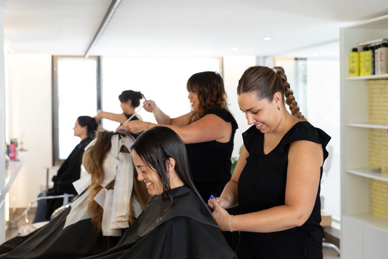 Female hairdresser cutting a client's hair - Buenos Aires - Argentina