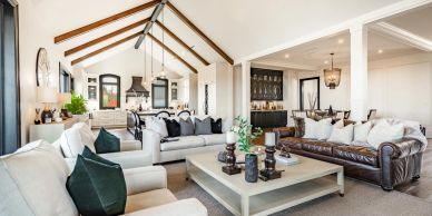 Spacious living room with vaulted ceiling and modern decor.