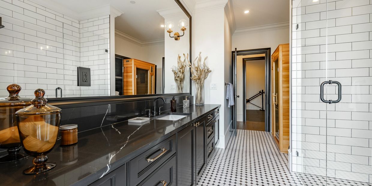 High-end custom bathroom remodel with tile shower and double vanity by Beautiful Homes LLC.